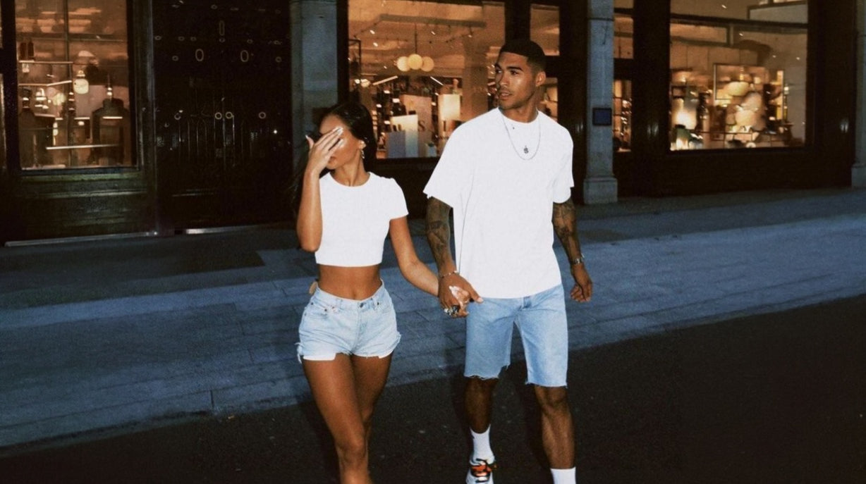bladezstudio couple wearing streetwear at night in the city
